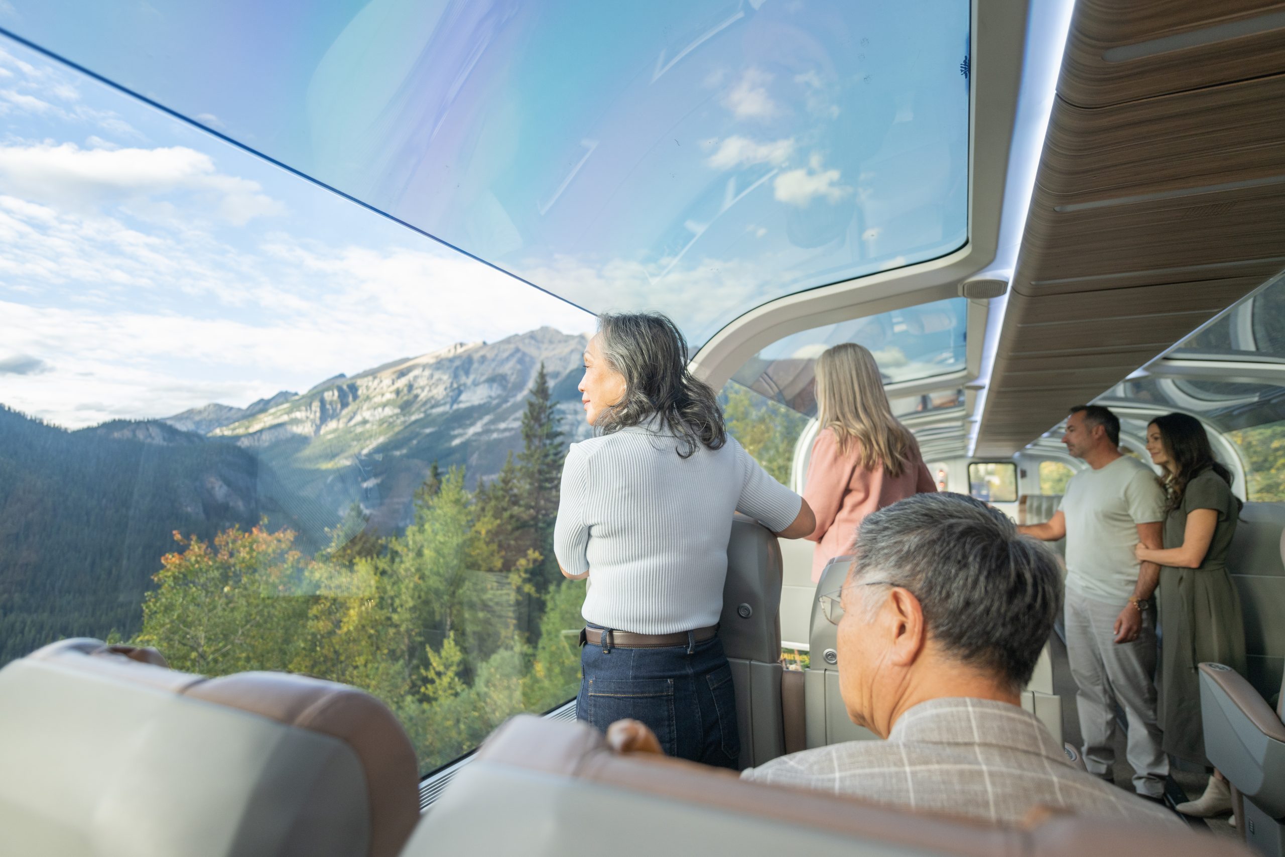 Inside the GoldLeaf Glass-dome coach, autumn colour and mountainsides filling the dome glass.